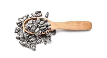 Spoon with sunflower seeds on white background