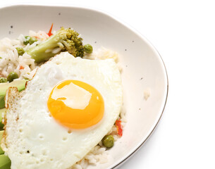 Plate with tasty egg, vegetables and rice on white background