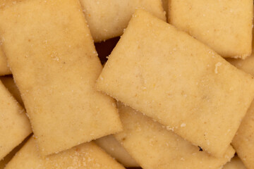 Cheese and garlic snack crackers portion very close view.