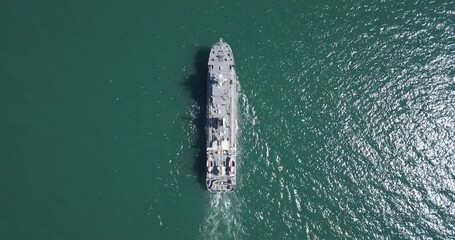 Aerial view of naval ship, battle ship, warship, Military ship resilient and armed with weapon systems, though armament on troop transports. support navy ship. Military sea transport.