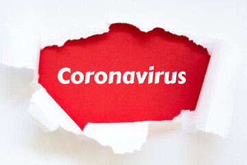 Coronavirus Word Written Under Torn Paper. Concept.