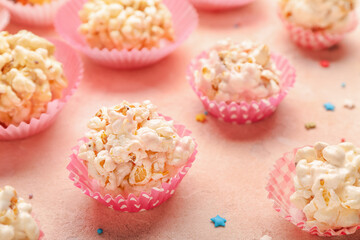 Tasty popcorn balls on color background