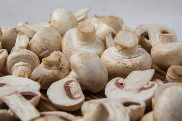 Whole and sliced fresh mushrooms close-up. Selective focus
