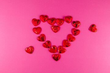frame of red hearts on a pink background in the holiday of love for Valentine's day on February 14