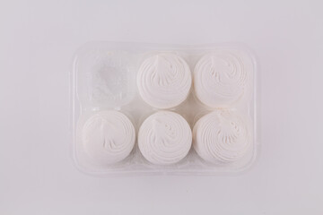 delicious white marshmallow on a white background. sweets with marshmallows for a holiday