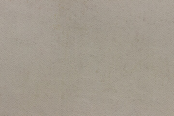 The surface of the brown old worn dermatin with a small pattern.