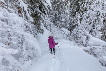 Snow shoeing in fresh snow above the pretty French Alpine village of Les Contamines-Montjoie