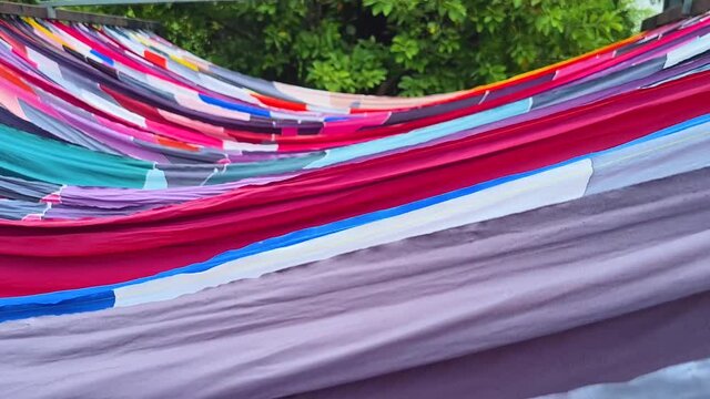 Colorful Traditional Malaysian Corak Batik Cloth Hanging Outdoors Under The Sun To Dry - Pan Right To Left