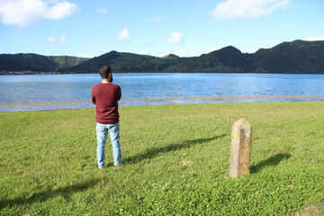 Man looking at lagoon