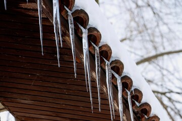 Wintertime icicles hanging from roof