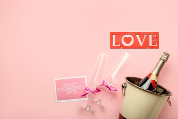 Bottle of champagne and glasses for Valentines Day celebration on color background