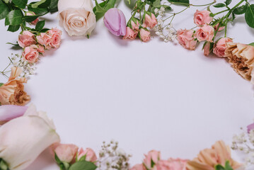spring flowers composition on white background. gillyflower, carnation, rose, daisy and tulips flat lay. floral composition as concept as spring season with center copy space