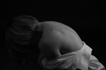 Monochrome photo of a girl bending back