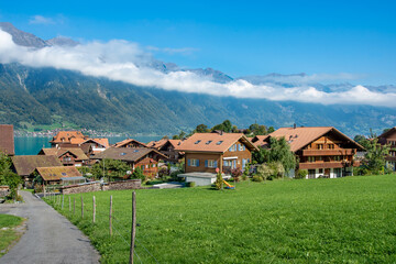 Fototapeta na wymiar Landscape of fishing village Iseltwald on lake Brienz, Switzerland.