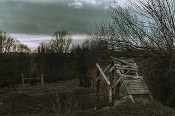 Moody landscape scene. Old wooden mine structure