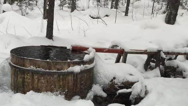 a traditional ice bath in a frozen outdoor pool.