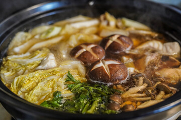 Hotpot of Japanese cuisine with lots of mushrooms and vegetables