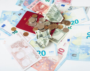 Cash on table isolated: dollars, euro, rubl broken money. All in mess, global crisis . passport travel concept