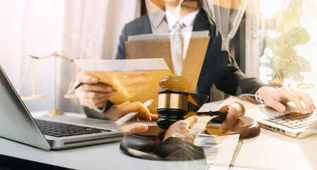 Business and lawyers discussing contract papers with brass scale on desk in office. Law, legal...