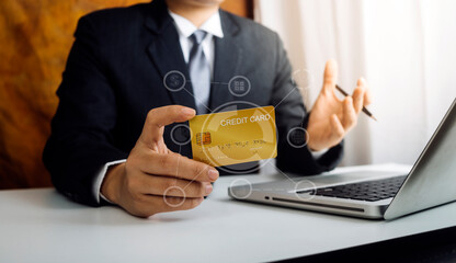 Fototapeta premium businesswoman hand using smart phone,mobile p payments online shopping,omni channel,digital tablet docking keyboard computer at office in sun light