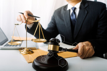 Business and lawyers discussing contract papers with brass scale on desk in office. Law, legal services, advice, justice and law concept picture with film grain effect