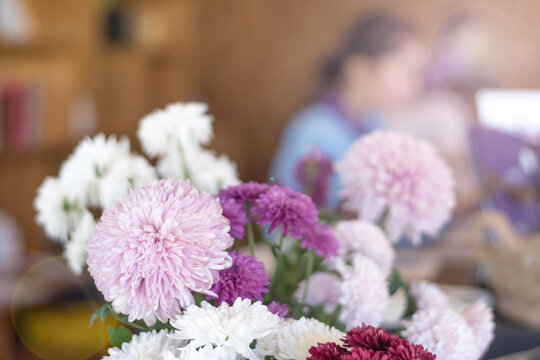 Hotel reception business concept. Customer holding purse and get information from mobile phone to checkin with receptionist working service at front desk lobby.