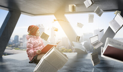 Little girl reading a book