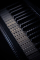 Old piano keyboard, with shallow depth of field