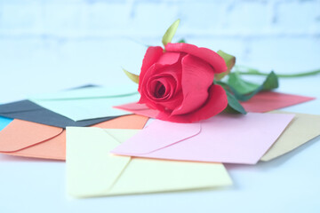 many envelope and rose flower on white background 