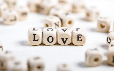 Love word written on wood block.