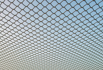 Fototapeta premium Iron net on the sky background 