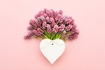 Pink flowers bouquet and white heart shape greeting card mockup for Valentine's Day, Birthday, Mother's, Women's day.