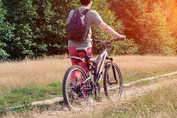 Tourist on a Bicycle in nature. A man with his mountain bike.