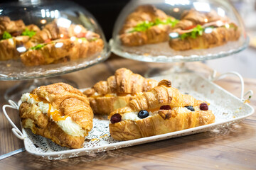 cafeteria tray with homemade scones and croissants. fresh appetizing pastries.