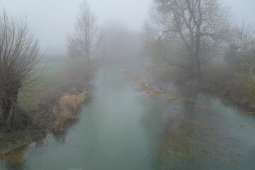 Misty river landscapes of the River Tove in England on a winter's day. 
