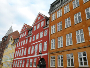 Fototapeta premium Nyhavn is the old port of Copenhagen with the colorful houses that are reflected in Nyhavn.