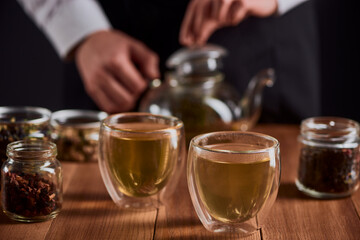 Close-up on glass cups of hot green tea