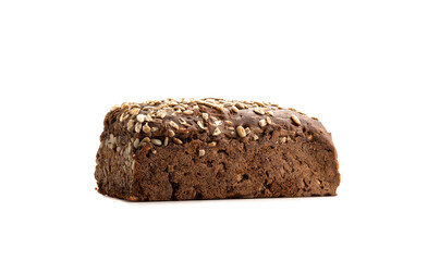 Whole loaf of homemade rye bread with sunflower seeds. Loaf of rye bread isolated on white background.