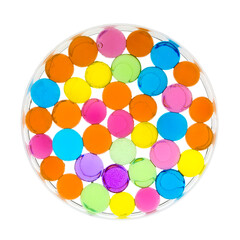 Backlit water crystal gels macro shot in a round glass container