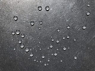 Water droplets on black background.