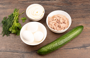 Ingredients for the tuna salad: canned tuna, eggs, cucumber, mayonnaise, dill and parsley.
