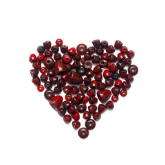 Heart of dark red coral beads on a white background