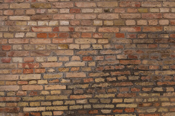 Old aged yellow orange red brick wall background texture
