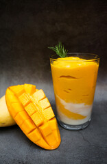 Fresh mango and mango yogurt smoothie in a glass