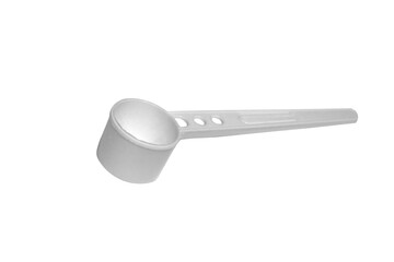 White plastic measuring spoon isolate on a white background close-up.
