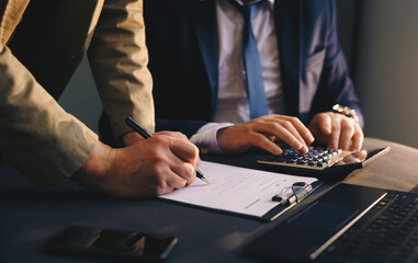 Businessmen have made a negotiation financial transaction and sign the contract. Loan to...