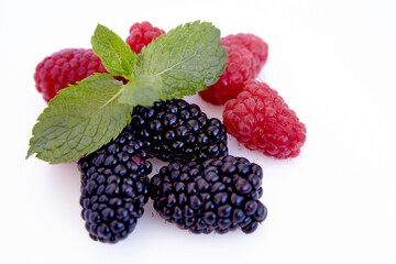 Raspberry and blackberry and mint isolated on white background. Vegan food, detox concept