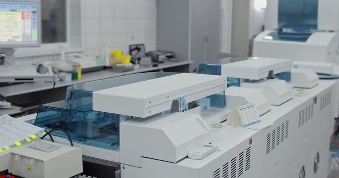 Crop view of modern medical research laboratory with computers and special biochemicals equipments. Concept of research, test, medicine, diagnostics.