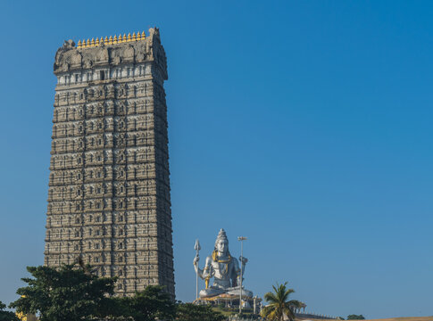 Landscape view of Gopura or Gopuram of Murdeshwar temple and Lord Shiva statue at Murdeshwar, Karnataka, India