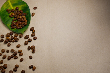 Large green-yellow leaf and coffee grains.